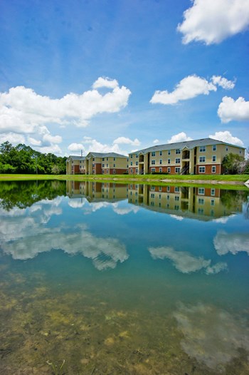 Building Exterior with Lake View and trees in the background